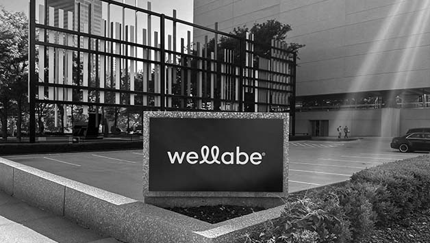 wellabe sign in front of building